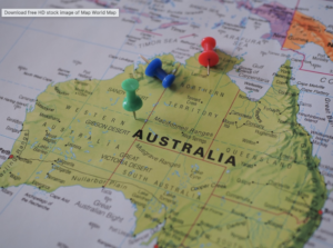 Map of Australia with several colored pushpins marking locations (red, blue, and green) on the country outline.